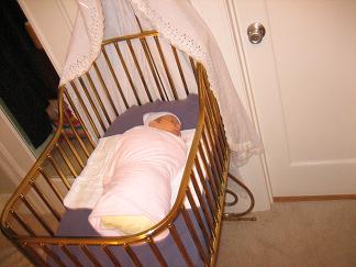 Zoe in her bassinet