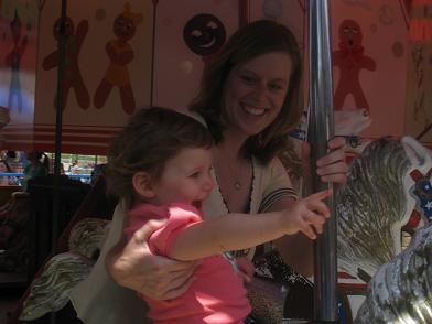 with-mommy-on-merry-go-round.JPG