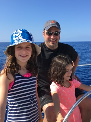 girls and Daddy on boat