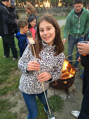 Zoe making smores