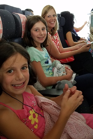 girls and Mommy on plane