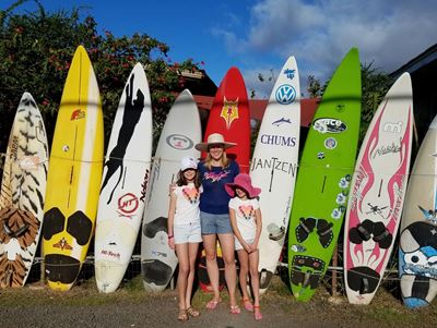 mommy-and-girls-by-surfboards